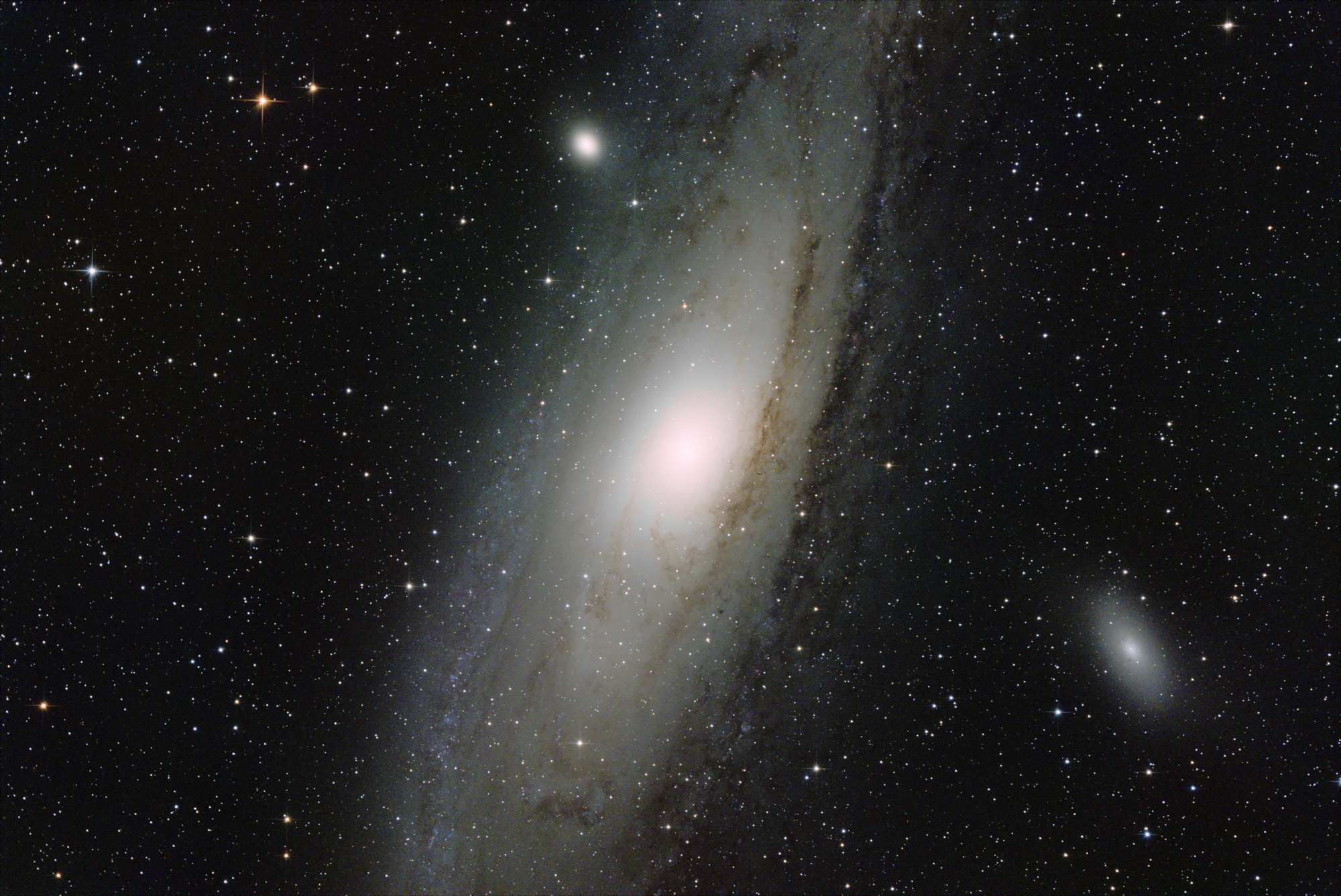 M31 and friends from September 14, 2024 &ndash; $29 \times 3 \mathrm{min}$ exposures (1h27m total) with the ASI2600MC-Pro @ -10C. Acquired with INDI + KStars/Ekos. Processed with Siril. Note the lower black level achieved with the ASI2600MC-Pro images.