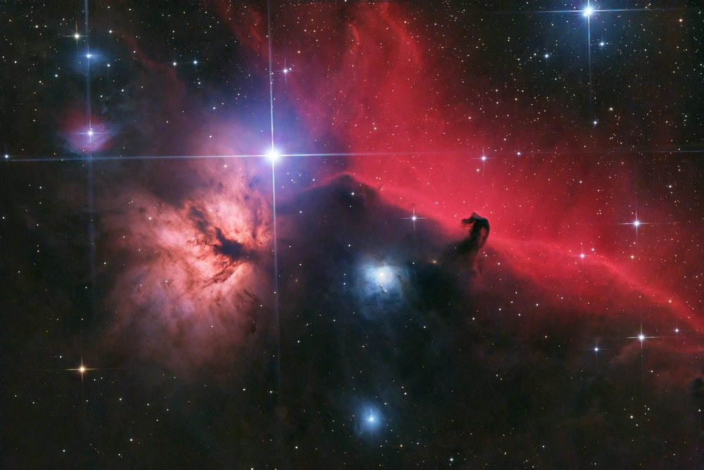 2hr (24 x 5min) Dualband + 2hr (40 x 3min) Broadband. Processed with GraXpert. Dualband split into Ha+Oiii and Oiii discarded. Ha continuum subtracted to remove broadband leakage, then mixed back into the broadband image to accentuate the Ha on the RGB image. The horse head is a dark nebula in front of IC434, which is a very strong emission nebula. All of this is mixed into the Orion Molecular Cloud star forming region.