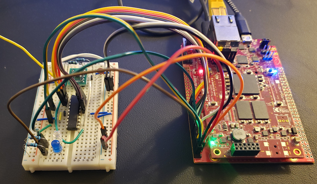 The current state of the WWVB direct conversion receiver. The &ldquo;antenna&rdquo; is the yellow wire going off to the left. Some status LEDs are included on the breadboard, with IO pins for selecting fake data mode, and performing a reset.